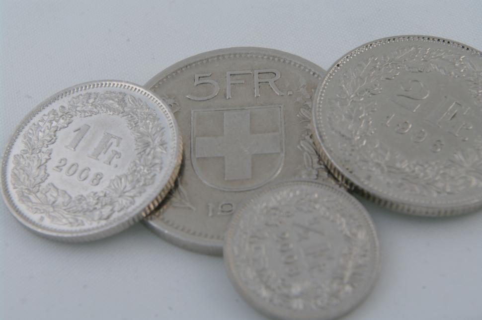 Free Image of Silver Coins on White Table 