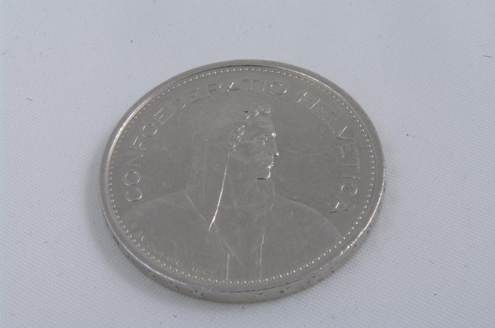 Free Image of Close Up of a Coin on a White Surface 