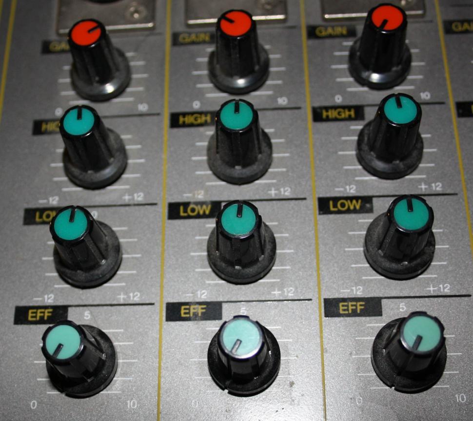 Free Image of Close-Up of a Sound Board With Knobs 