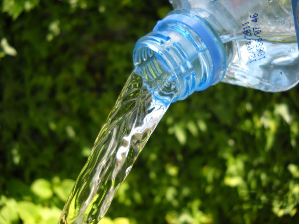 Free Image of Close Up of Water Bottle Being Filled With Water 