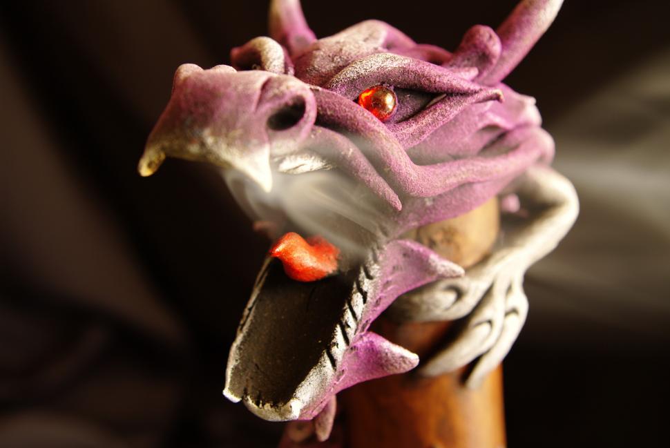 Free Image of Close Up of Dragon Head on Wooden Stick 