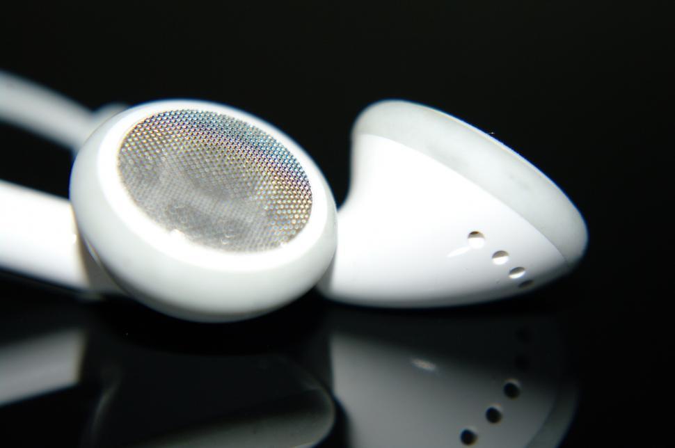 Free Image of White Headphones on Table 