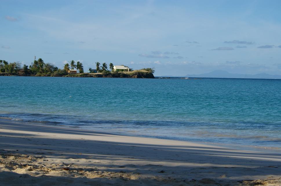 Free Image of Beach With Small Island in Distance 