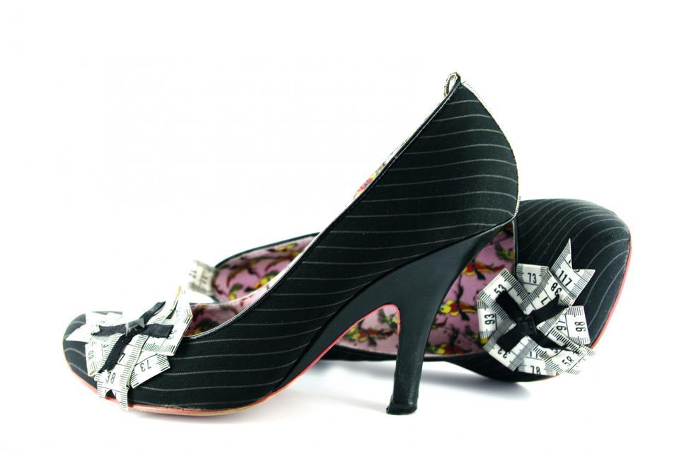 Free Image of Stylish Black and White Shoes With Bows 