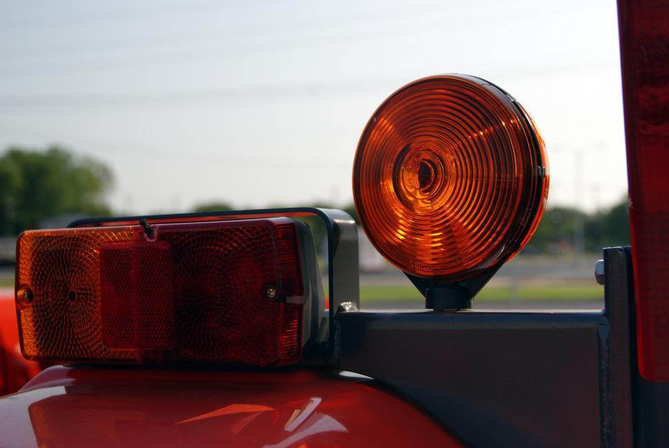 Free Image of Tail Lights on a red tractor 