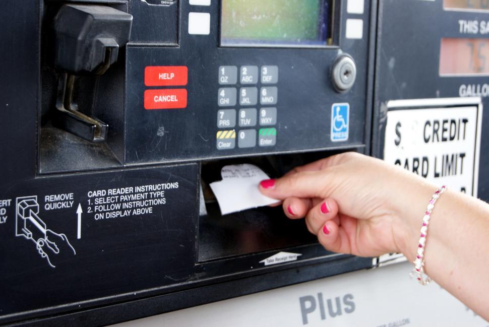Free Image of Womans Hand Pressing Button on Gas Pump 