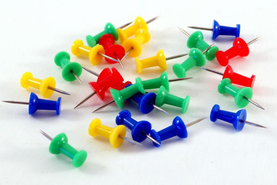Free Image of Colorful Pins Stacked Together 