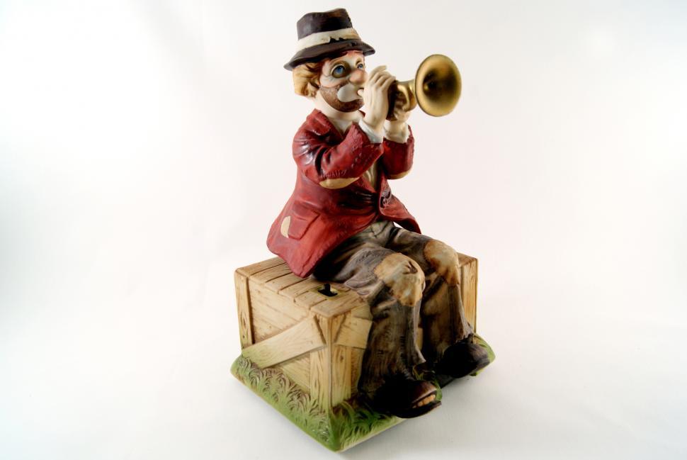 Free Image of Man Playing Trumpet Figurine 