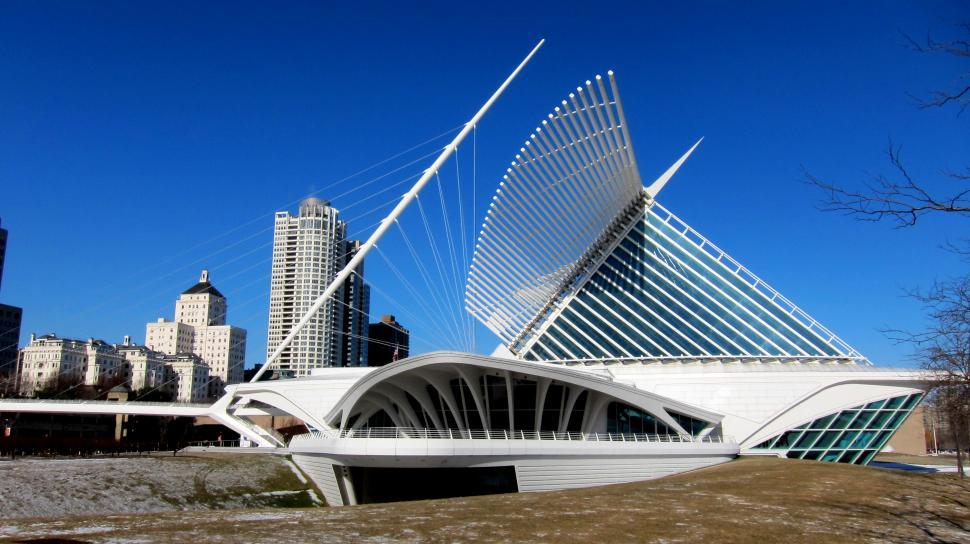 Free Image of Large White Building Next to River 