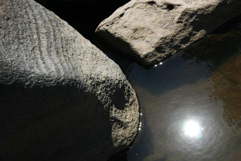 Free Image of river gorge feather california stream rocks water riverbed streambed sun reflection glare puddle pool dried mud dry strata 