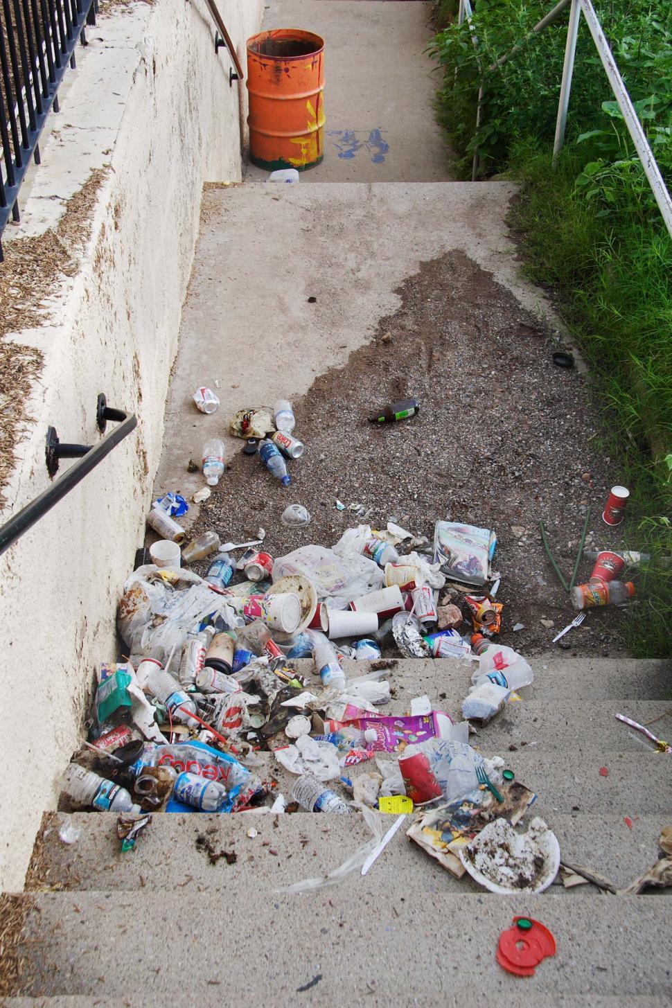 Free Image of Garbage scattered along stairway  