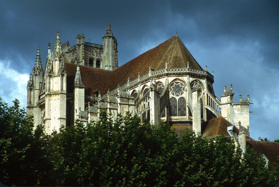 Free Image of france cathedral gothic flying buttresses looming forboding threatening indimidating stone building french europe european religious Auxerre historic stormy 