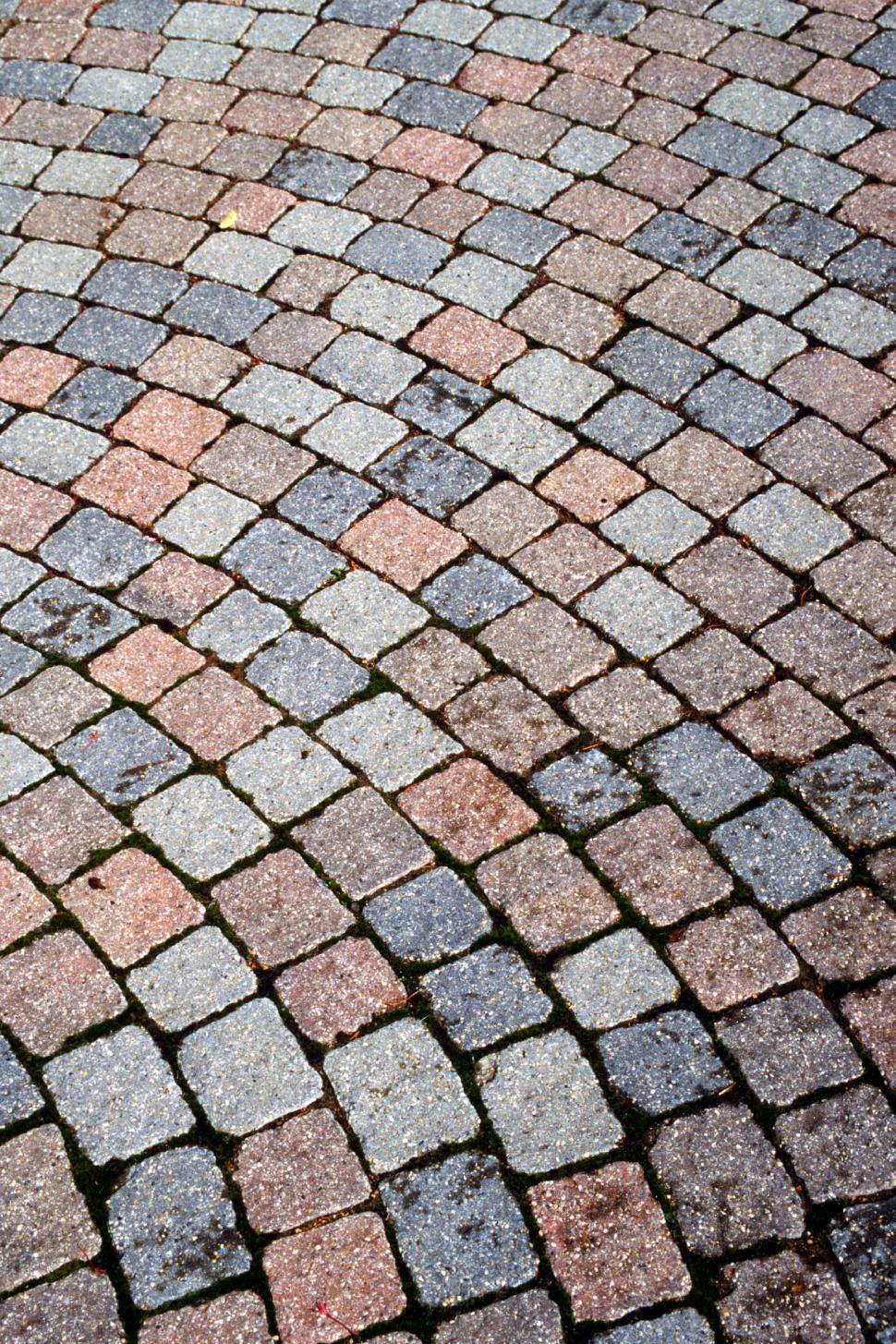 Free Image of cobblestones bricks pavers radial arranged patters masonry textures backgrounds mossy stones blocks curves curved patio walkway 