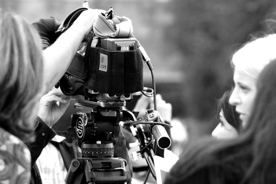 Free Image of Cameraman Filming Girl 