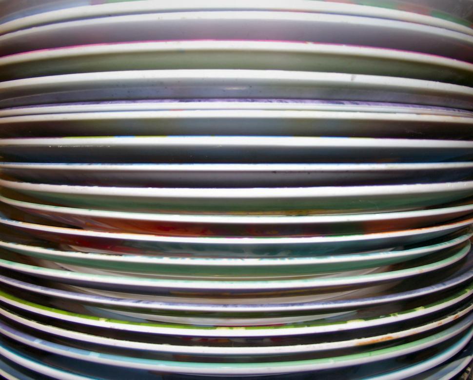 Free Image of Stack of plastic plates edge on 