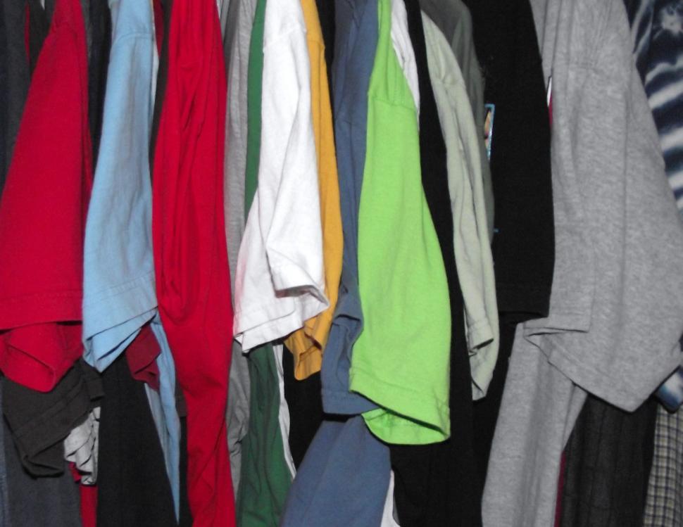 Free Image of T-shirts hanging in a row 