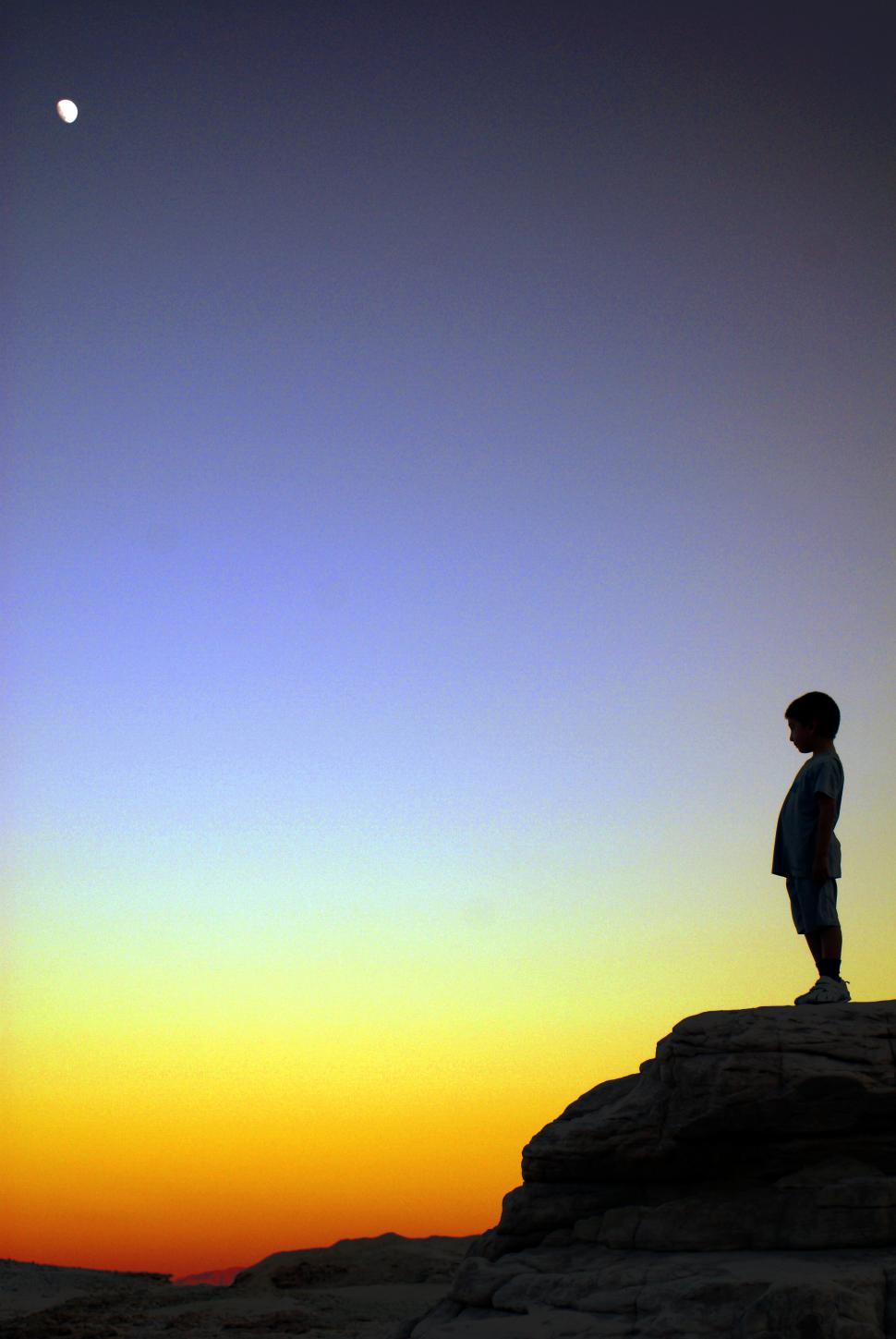 Free Image of a boy in sunset 