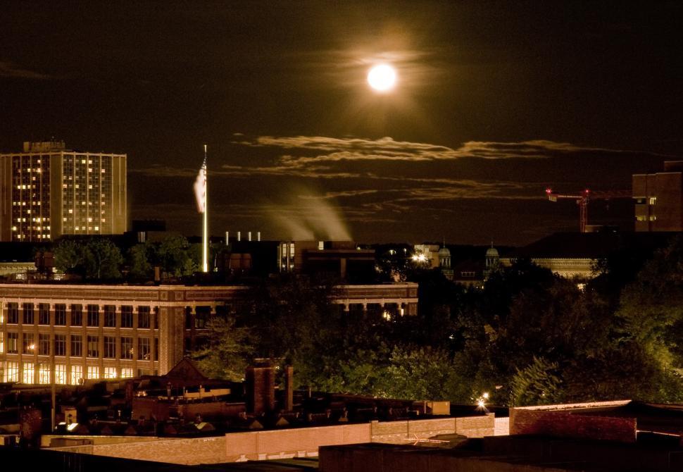Free Image of Full Moon Over City at Night 