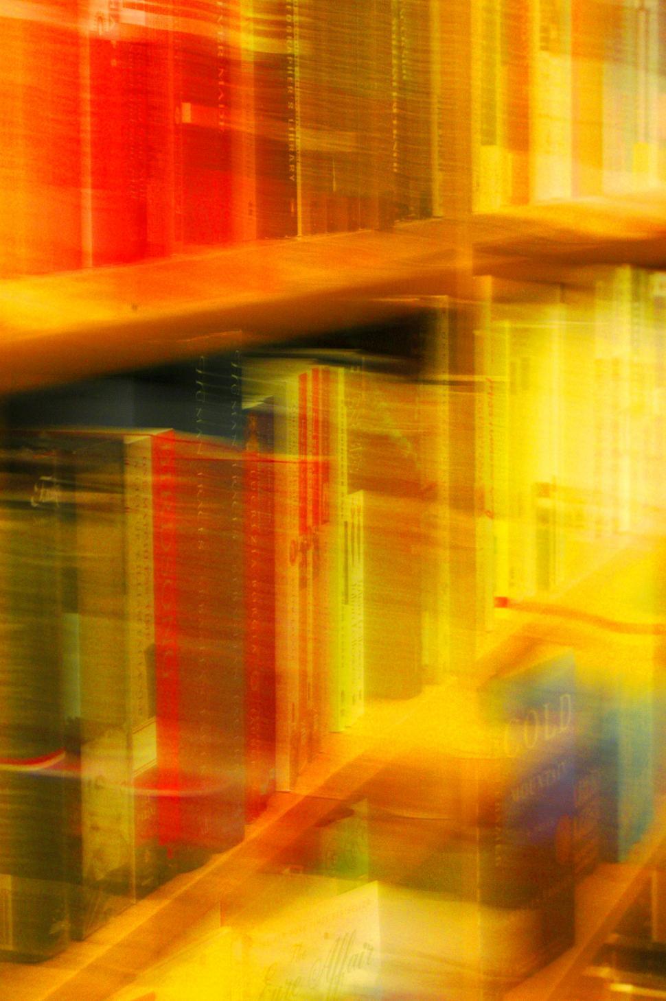 Free Image of Blurry Photo of Bookshelf Filled With Books 