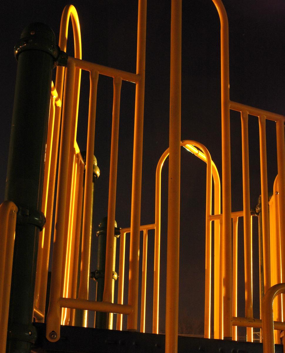 Free Image of Industrial Structure With Yellow Pipes Illuminated at Night 