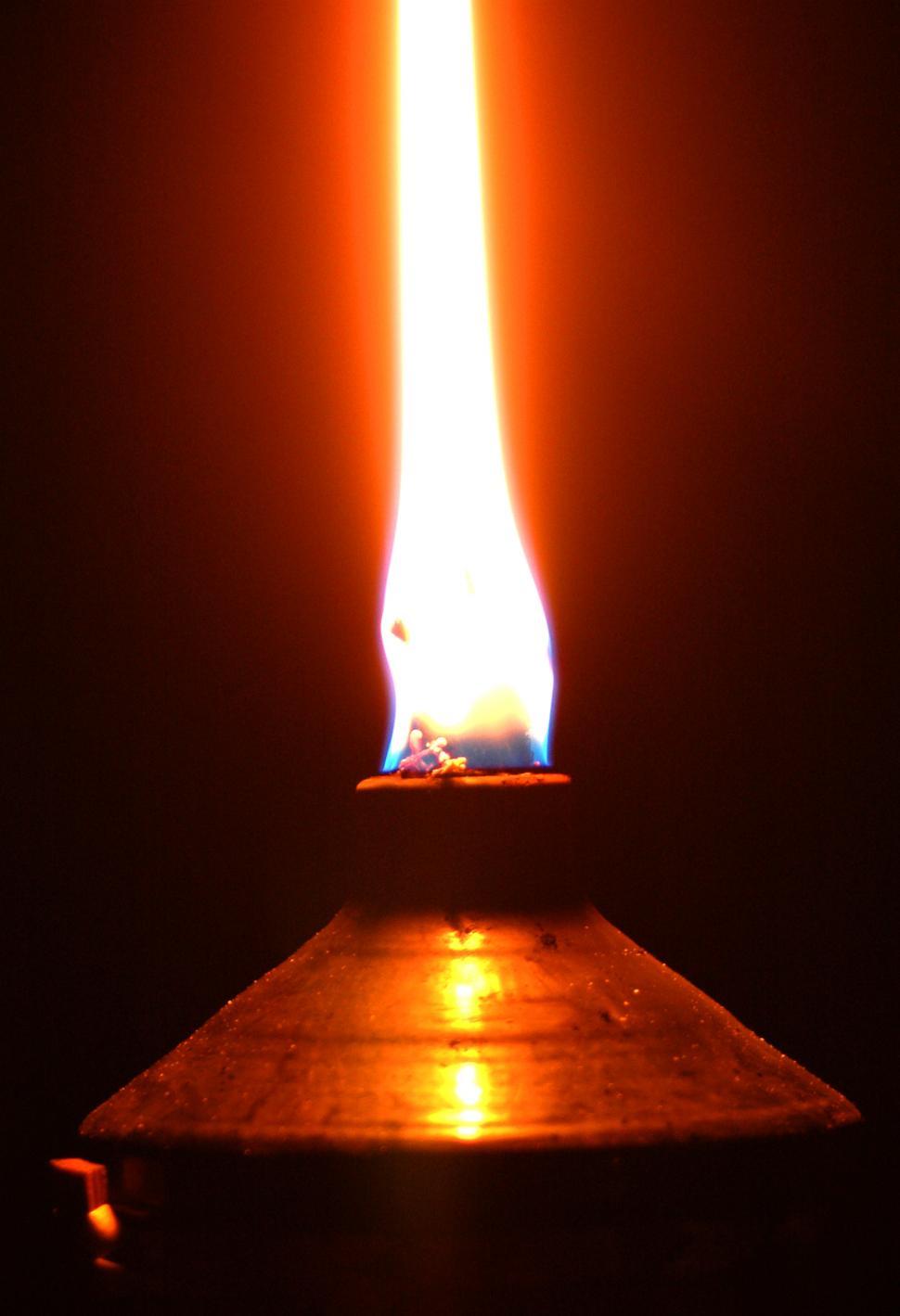 Free Image of A Candle Illuminated in Darkness 