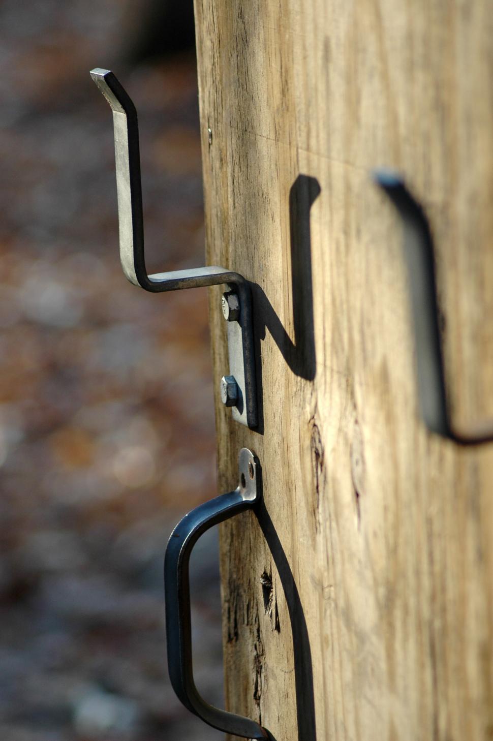 Free Image of Close Up of Wood With Metal Hook 