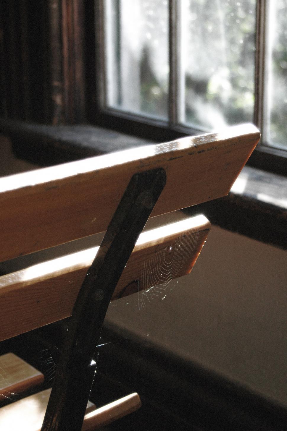 Free Image of Close Up of Wooden Bench Near Window 
