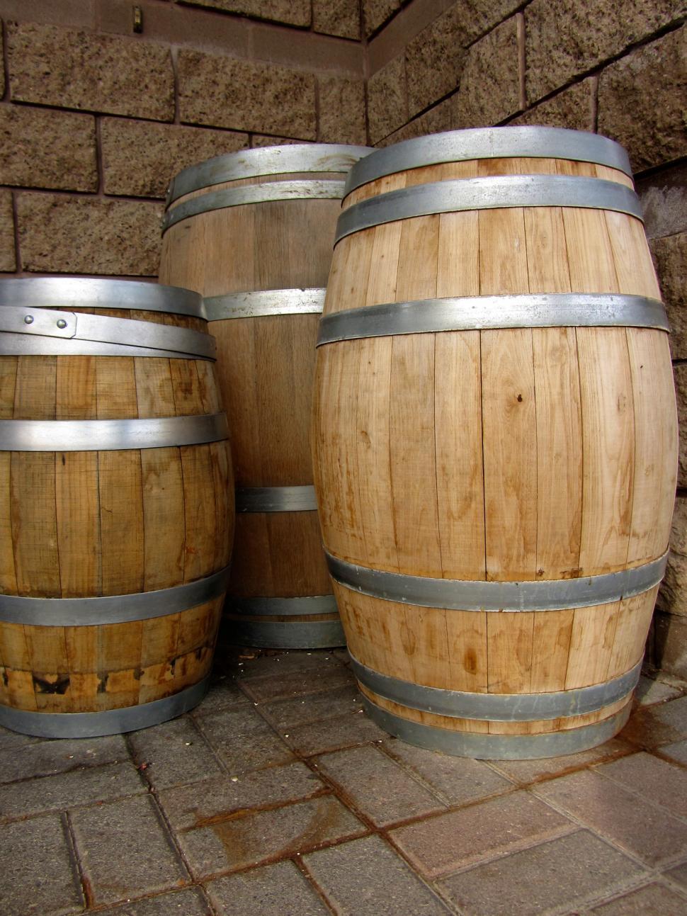 Free Image of Three Wooden Barrels Arranged in a Row 