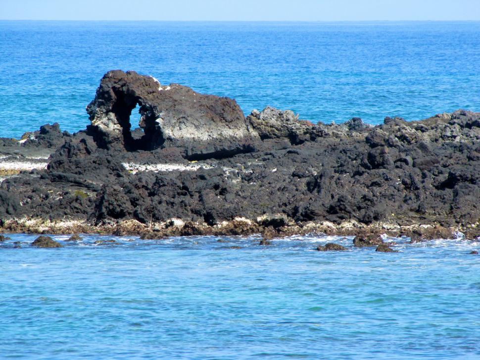 Free Image of Rock Outcropping in the Middle of the Ocean 