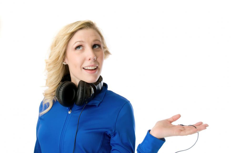 Free Image of Young woman with headphones on neck 