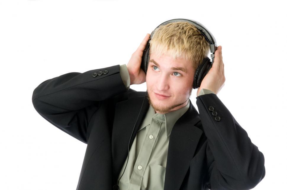Free Image of Young man listenes to headphones 