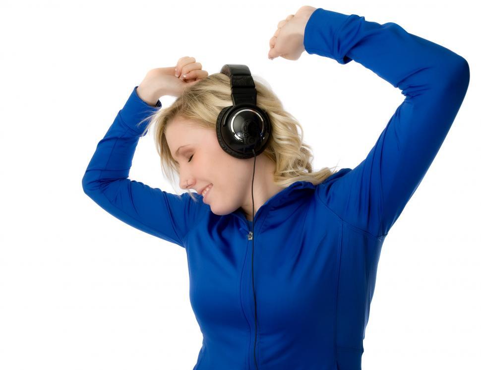 Free Image of Woman Wearing Headphones and Blue Shirt 