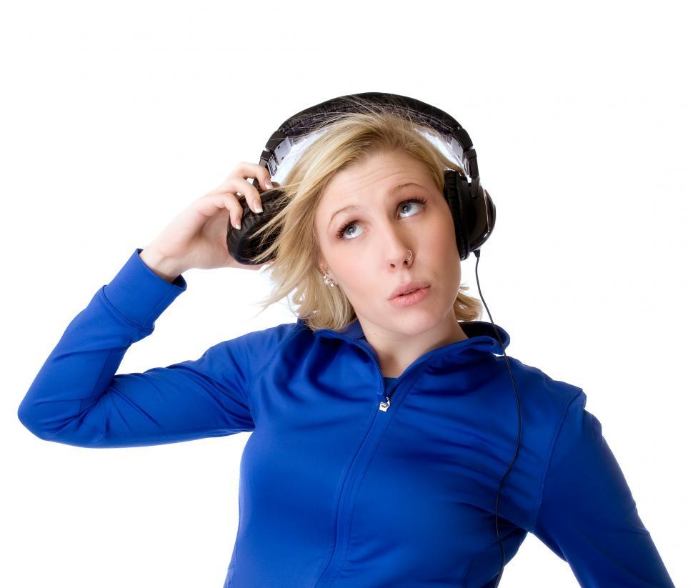 Free Image of Young woman listens on one side 