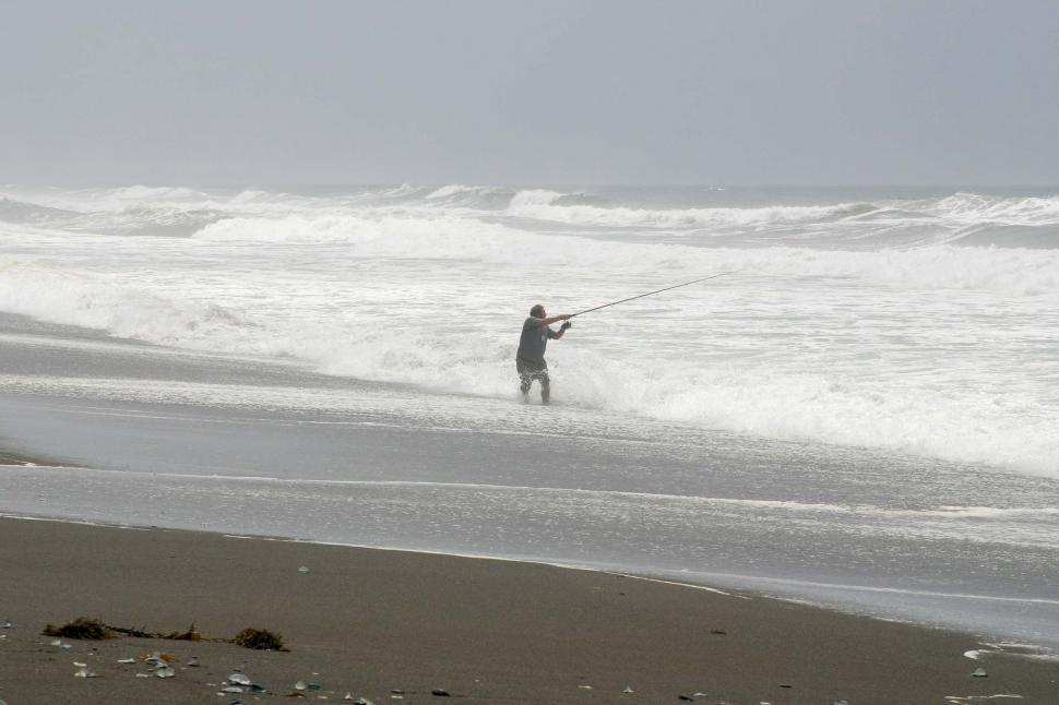 Free Image of beach coast coastal ocean fog sand california northern water coastline sea fishing fisherman rod reel cast wade wave waves fish 