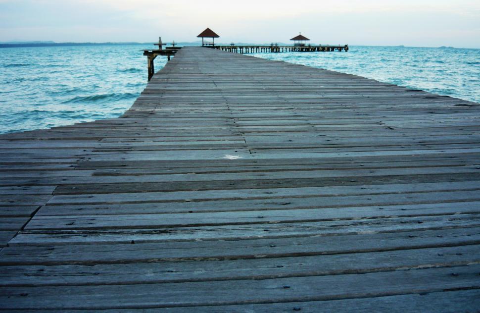 Free Image of Long Wooden Tropical Pier at sunset 