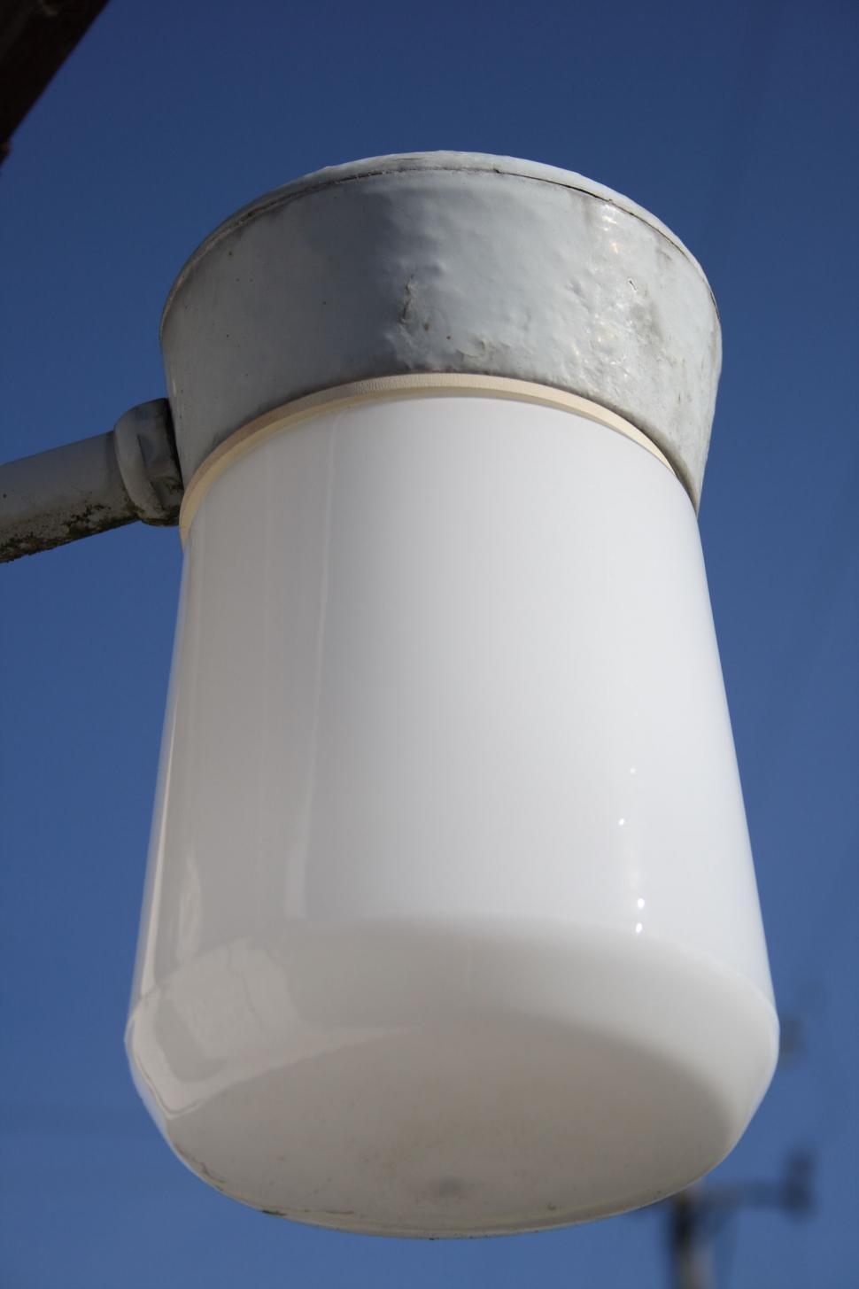 Free Image of White Light Fixture Against Blue Sky 