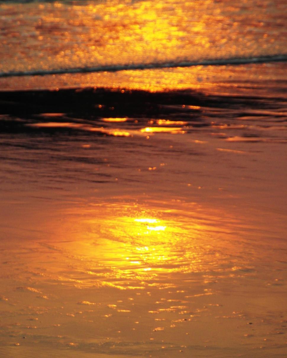 Free Image of Suns Reflection in the Sand 
