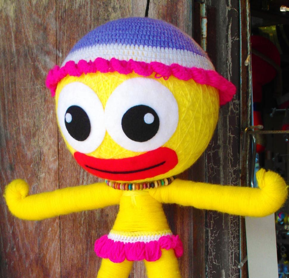 Free Image of Bright Yellow Kids Doll 