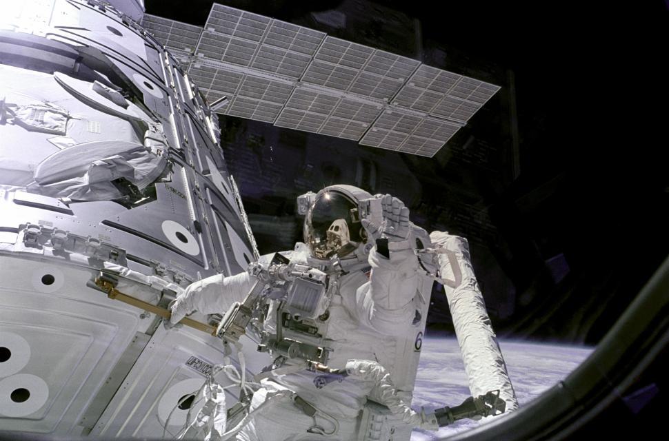 Free Image of Astronaut Newman Waves at Camera from Unity Module 