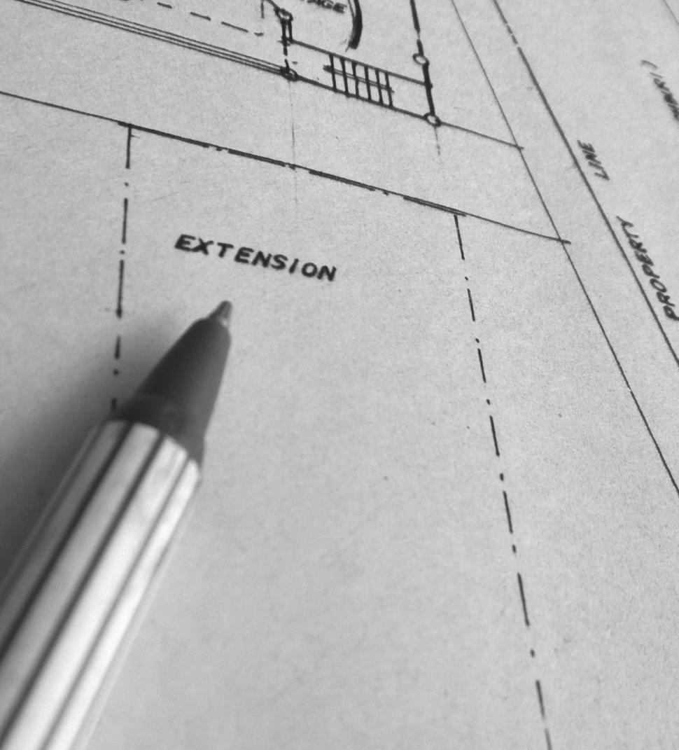Free Image of Building Blueprint with pen 
