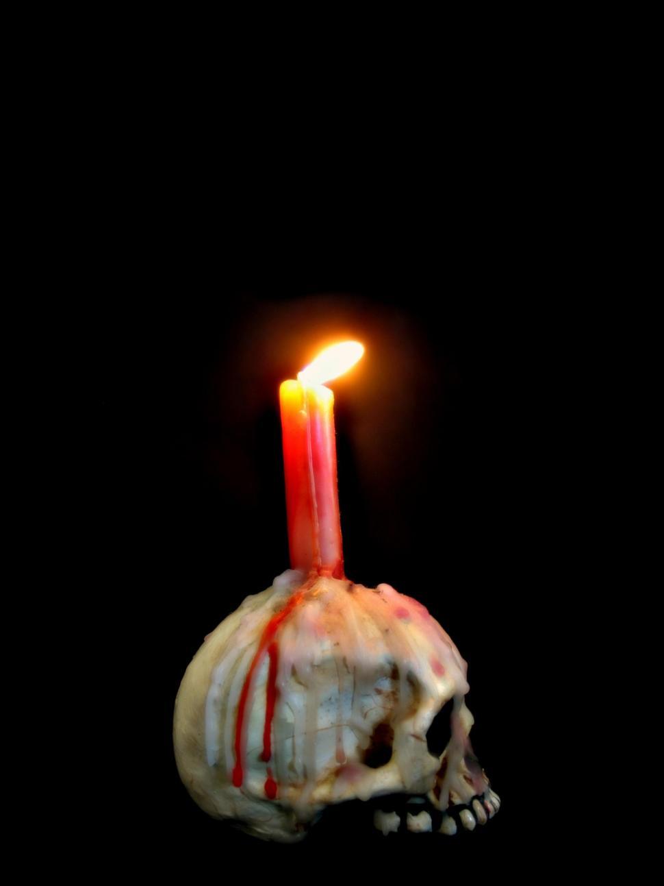 Free Image of A Candle Burning in the Dark 