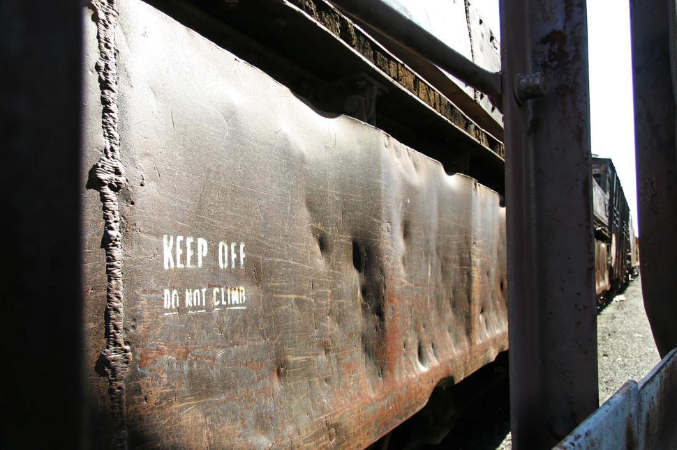 Free Image of train california rust decay words metal decommission scrap texture machine weld word dent dents keep off do not climb flatbed car 