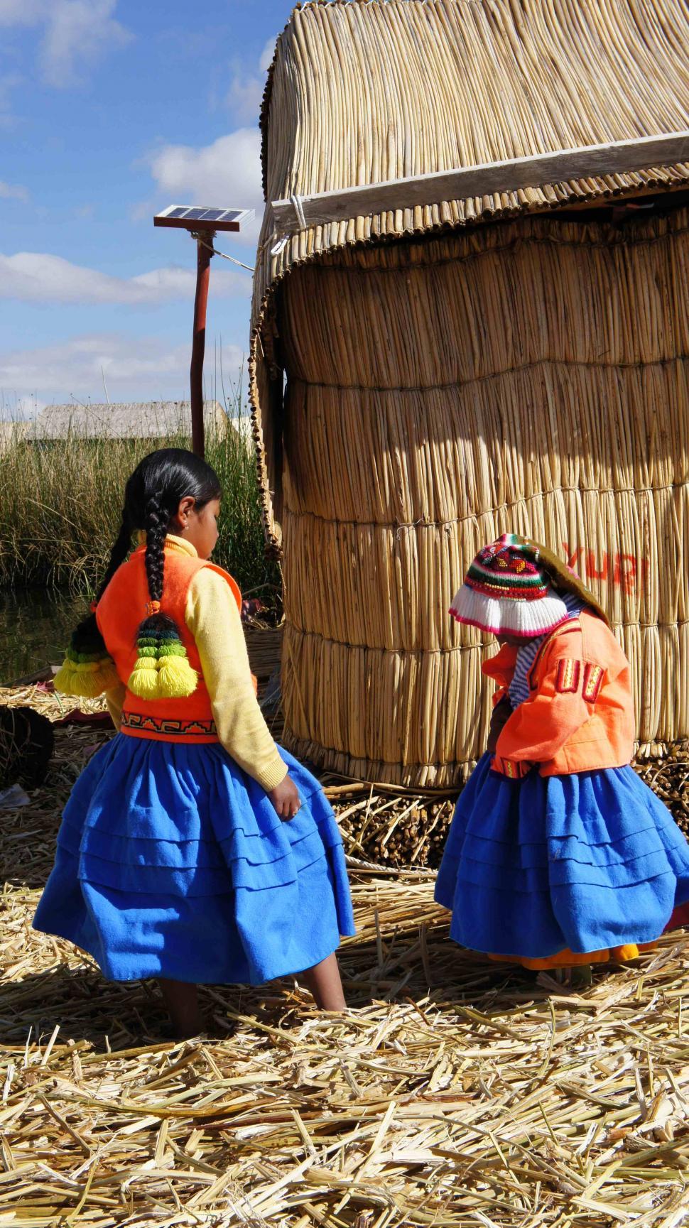Free Image of Lake Titicaca Buildings and Families 