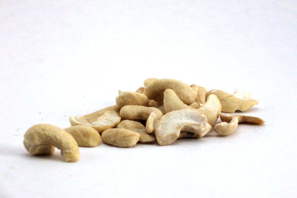 Free Image of A Pile of Cashews on a White Surface 