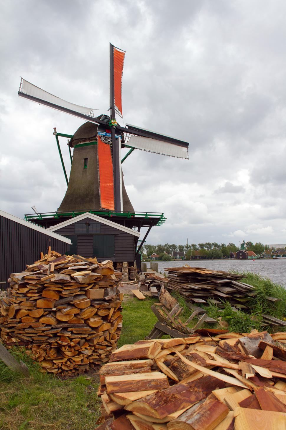 Free Image of Windmill and Wood Logs 