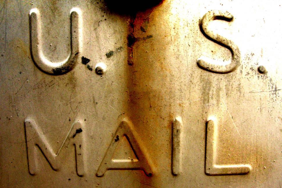 Free Image of Close Up of a Metal Sign With the Word US Mail 