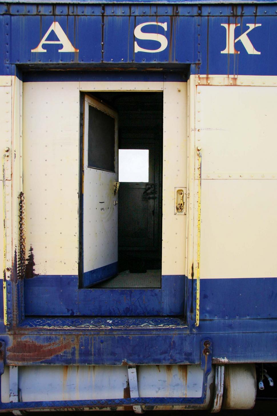 Free Image of Blue and White Train Car With Open Door 