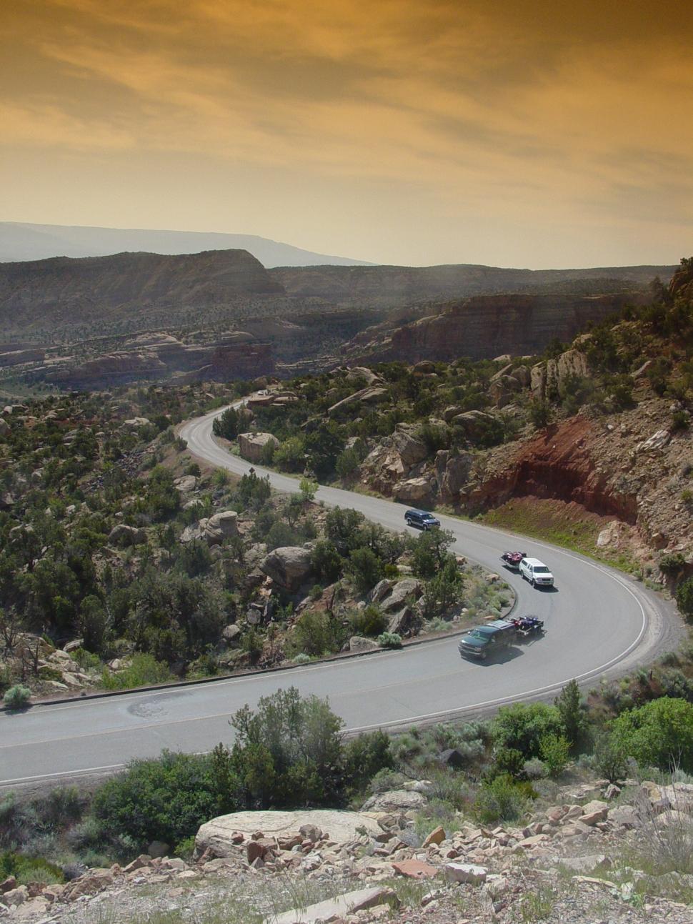 Free Image of Winding Desert Road through the Red Rocks 