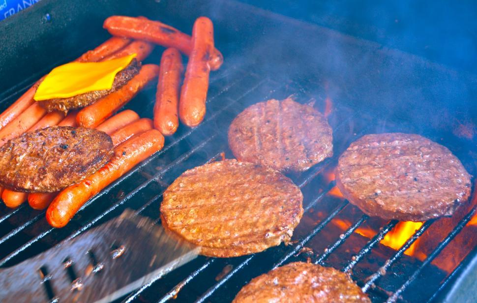 Download Free Stock Photo of BBQ Grill with Hamburgers and Hot Dogs 
