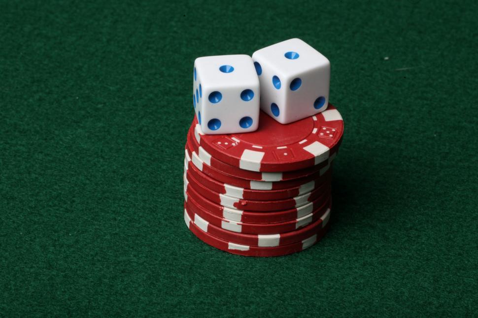 Free Image of Two dice on red poker chips 